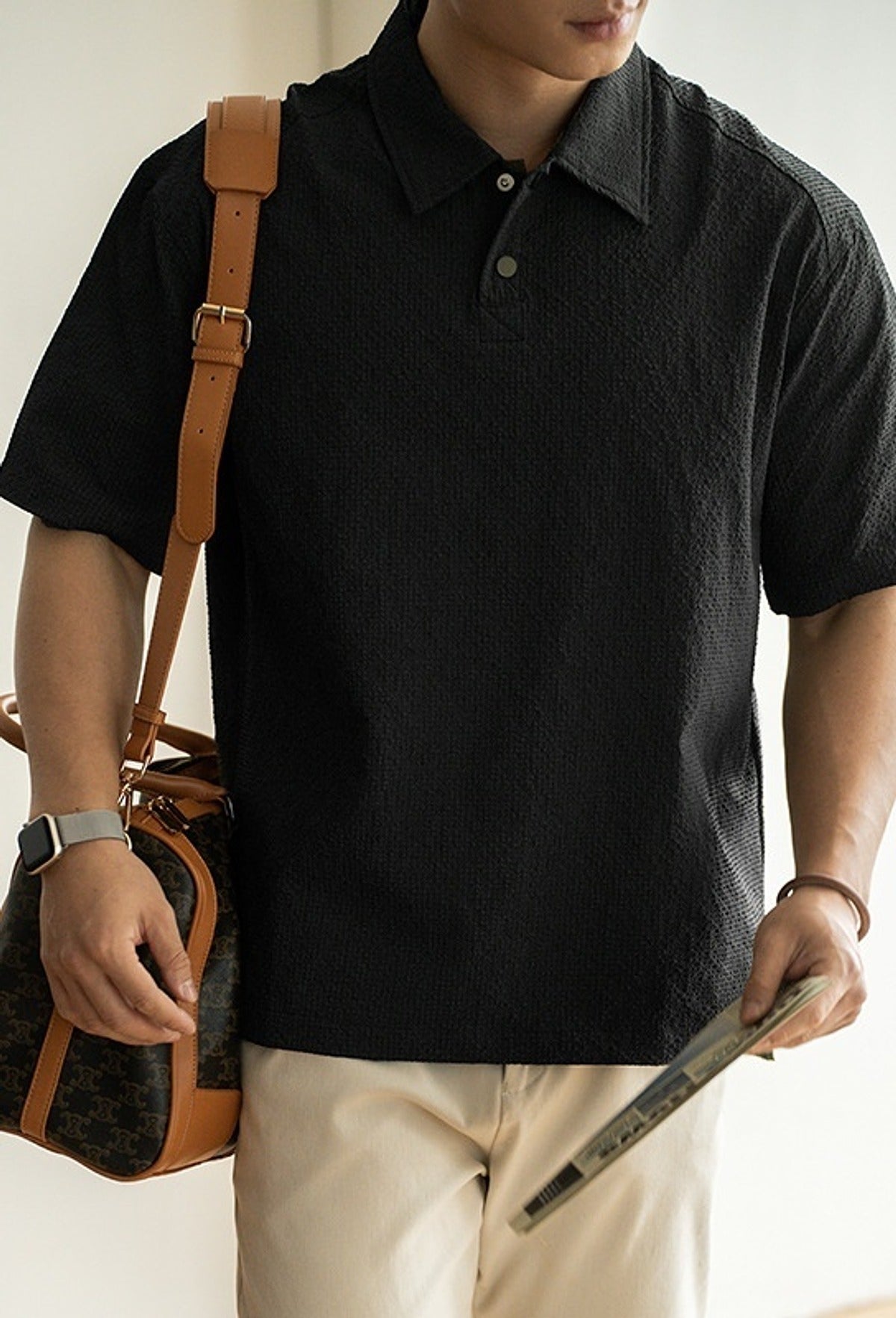 Awa Seersucker Polo Shirt in Black, full-length front view
