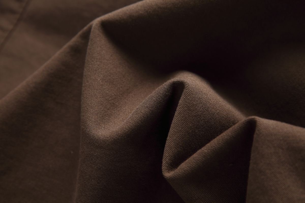 Fabric detail of the Hagane jacket showing the diagonal weave of the brown cotton twill