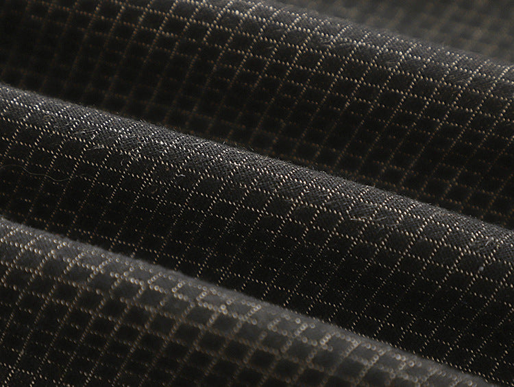 Fabric detail of the Karo haori jacket showing the dark indigo diamond dobby weave with pale warp threads