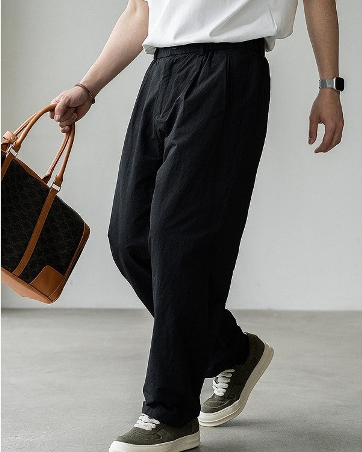 Momi Crinkle Harem Pants in Black, full-length front view