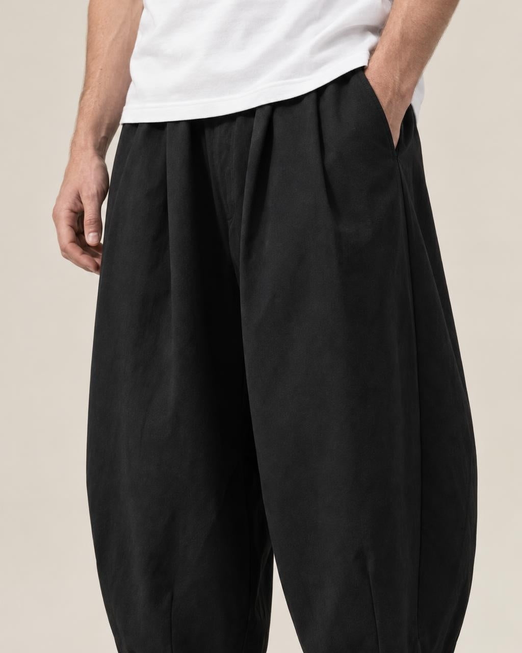Raku Wide Cargo Pants in Black, close-up on the model