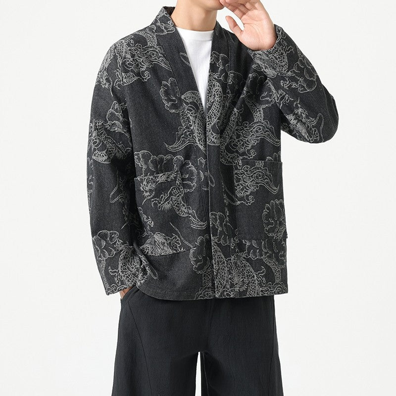 Unryu denim haori in washed black, close view of the cloud-dragon print across the chest and sleeve